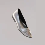 Silver covered flats with a sleek front angle profile and elegant finish