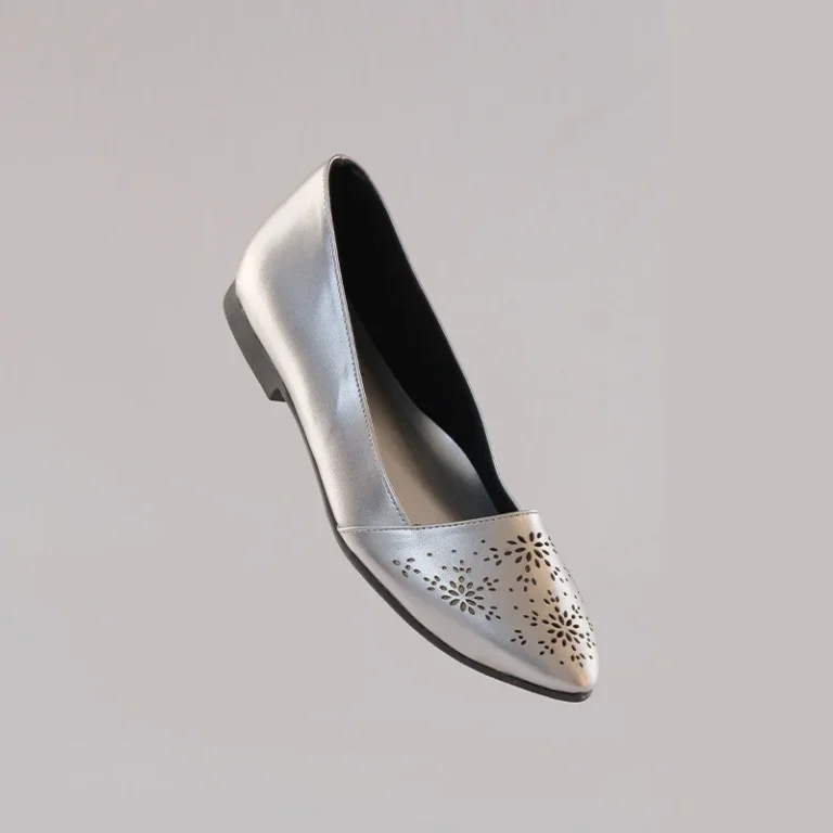 Silver covered flats with a sleek front angle profile and elegant finish