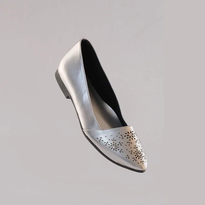 Silver covered flats with a sleek front angle profile and elegant finish