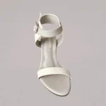 Genelle White Ankle Strap Heel (S/829) shown in a detailed product view. The image highlights the white colour and ankle strap heel design.