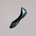 Black side front covered shoes showing elegant shape and handcrafted construction