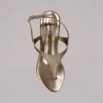 Gold slingback wedge with premium finish and elegant women’s footwear styling
