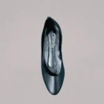 Black covered flats profile view with classic closed-toe styling for women